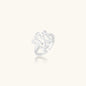 Sculptural sterling silver ring with organic branch design and textured surfaces on cream background