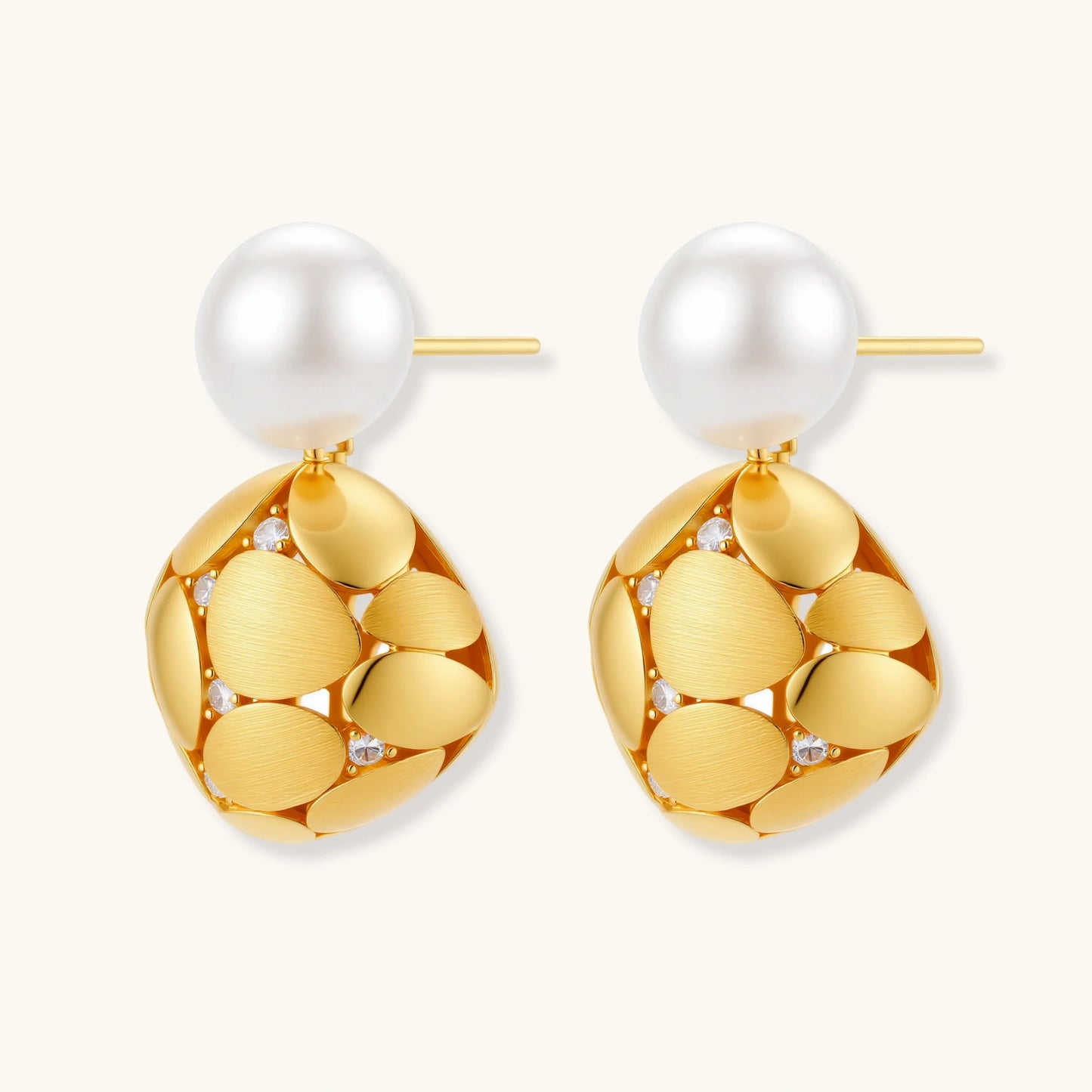 Gold-plated sterling silver drop earrings with white freshwater pearl studs and overlapping petal design with crystal accents