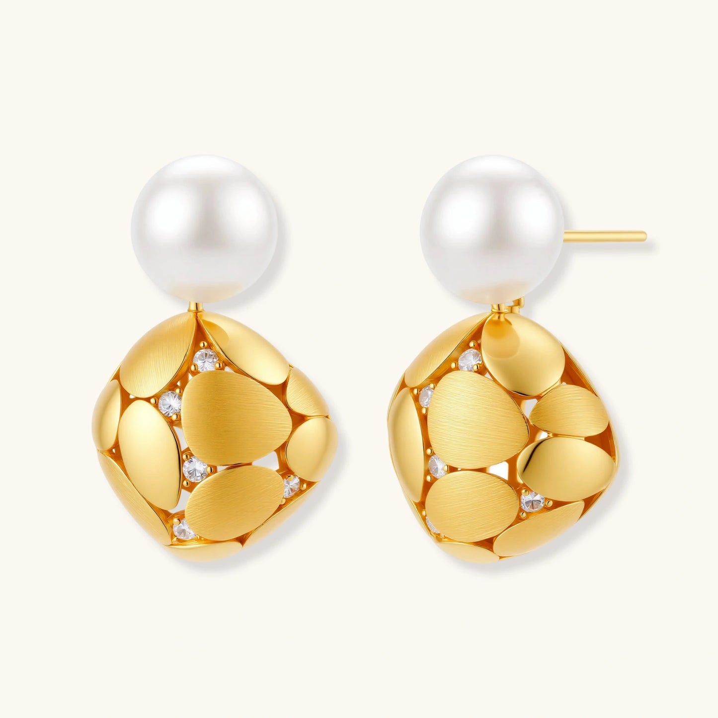 Gold-plated sterling silver drop earrings with white freshwater pearl studs and overlapping petal design with crystal accents