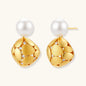 Gold-plated sterling silver drop earrings with white freshwater pearl studs and overlapping petal design with crystal accents